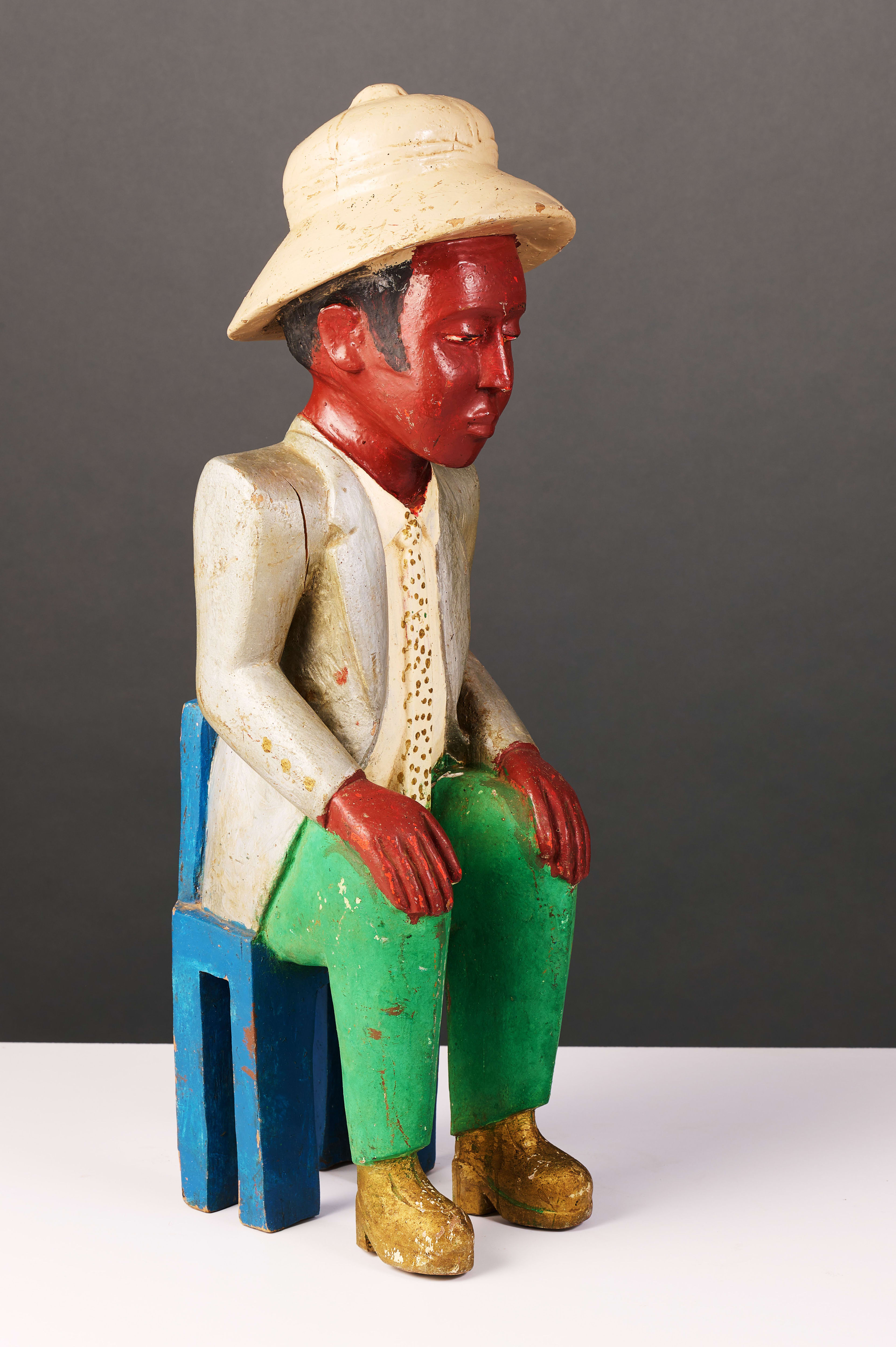 Colon seated figure, West Africa | Strauss & Co