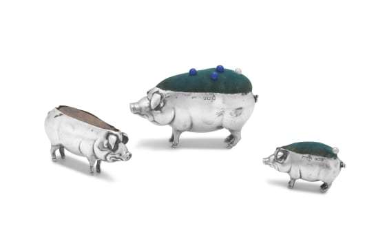 Three silver pig pin cushions, Adie & Lovekin Ltd, S & Co, maker's mark worn, Birmingham, 1906-1943