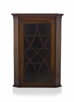A George III style mahogany hanging corner cupboard