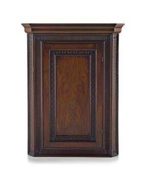 A Regency mahogany corner cupboard