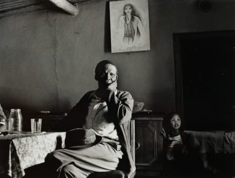 Santu Mofokeng; Paul Dintshi and Child: Sunday at a Shebeen