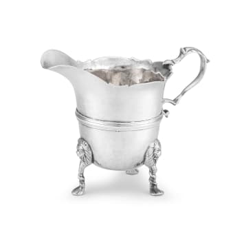 An Irish silver cream jug, maker's initials RC, Dublin, mid 18th century