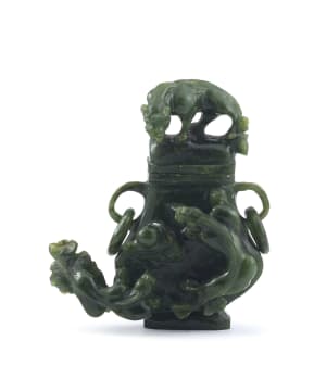 A Chinese spinach green jade vase and cover, Qing Dynasty, 19th century