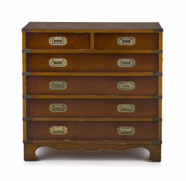 A small mahogany-veneered brass-bound military chest