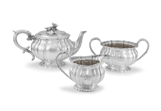 A George IV silver-gilt three-piece tea service, Robert Garrard, London, 1826-1833, retailed by Garrards, Panton Street, London