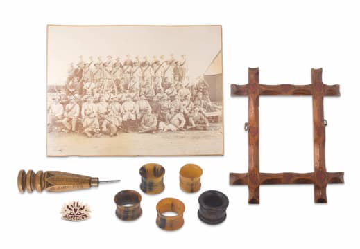 A small carved wooden Boer War Prisoner of War frame