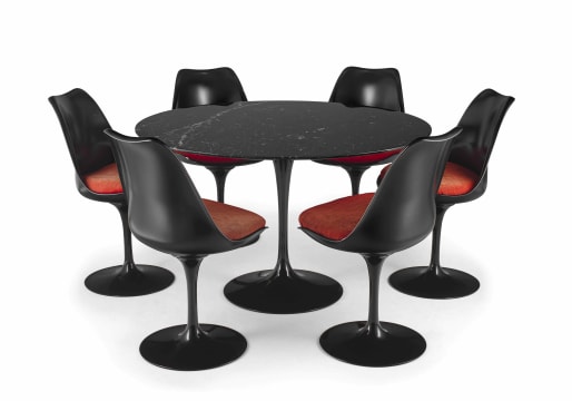 A set of six black lacquer Tulip chairs, model 151 and a Tulip marquinia marble and black lacquer table designed 1955-56 by Eero Saarinen, later edition