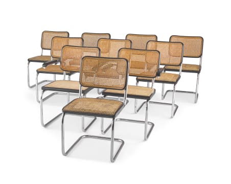 A set of eight black lacquer chrome and caned model B33 dining chairs designed by Marcel Breuer for Thonet