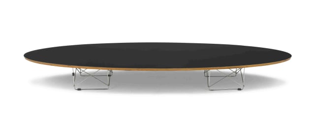 A black lacquer and metal Surfboard table designed in 1951 by Charles and Ray Eames, later edition