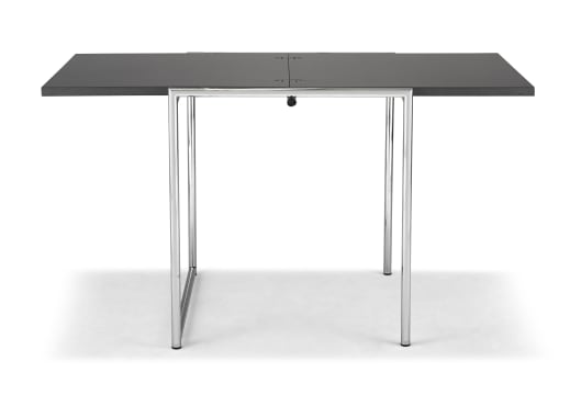 A chrome and black-veneered extending Jean table designed in the 1920s by Eileen Gray, later edition
