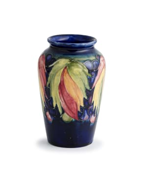 A William Moorcroft leaf-and-berry pattern vase, 1928-1949