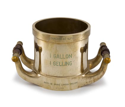 An Elizabeth II brass one gallon two-handled measure, 1959