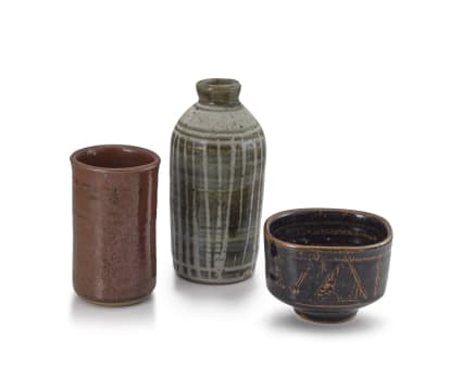 Brown stone cylinder vase, brown bowl and a bottle vase