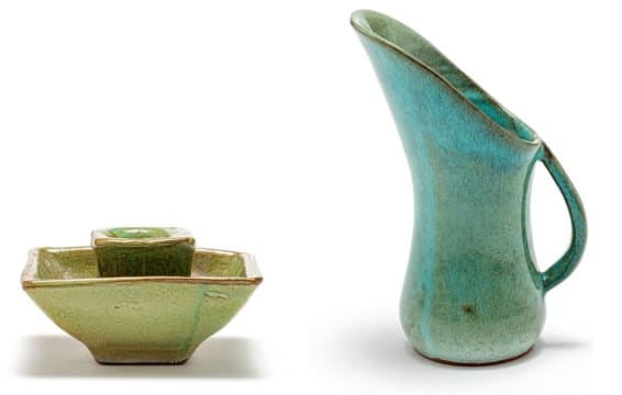 A Globe green-glazed candlestick