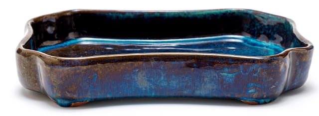 A Globe dark blue, turquoise and purple-glazed dish