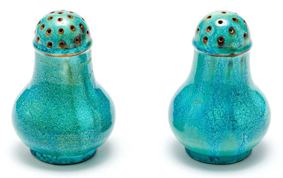 A pair of South African blue and green-glazed salt and pepper shakers