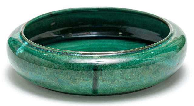 A Globe iridescent green-glazed bowl