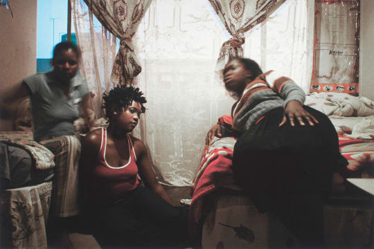 Guy Tillim; Tshililo (right) and her friends share a one-roomed apartment in Cape Agulhas, Esselen Street, Hillbrow
