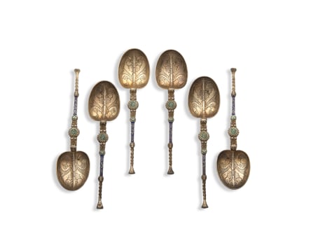 A cased set of six Victorian silver-gilt, seed pearl and enamel anointing spoons, Levi & Salaman, Birmingham, 1901, retailed by M. Montague, Sucesor de Julio Frank, Iquique