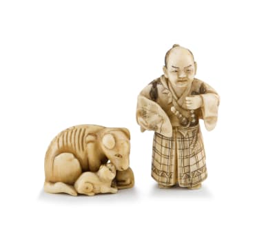 A Japanese ivory netsuke of a dog and her pups, Meiji period, 1868-1912