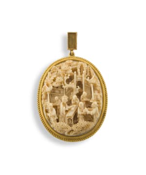 A Chinese ivory and gold-mounted pendant, Qing Dynasty, 19th century