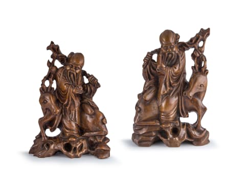 A pair of mirror image Chinese hardwood figures of Shou Xing with deer, late Qing Dynasty, late 19th century