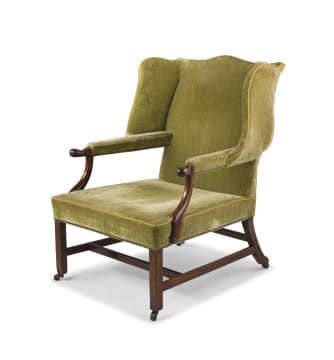 A George III mahogany wingback armchair, circa 1765