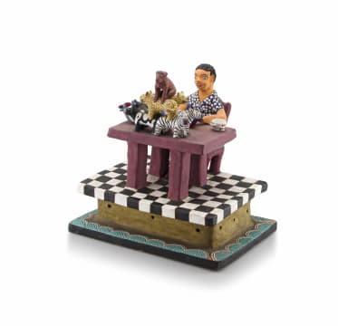 A hand-painted and bisque fired self portrait of Bonnie Ntshalintshali (1967-1999), 1991
