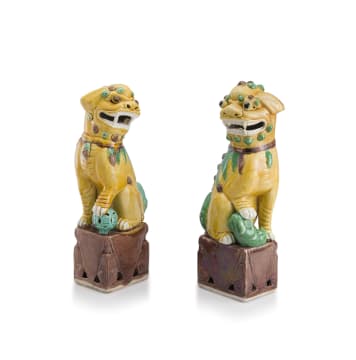 A pair of Chinese yellow, green, cream and aubergine-glazed dogs-of-fo, 20th century