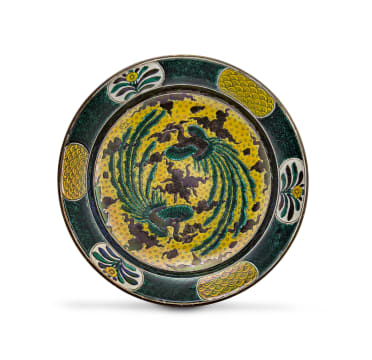 A Japanese ko-kutani iridescent yellow, purple and black enamelled dish, Edo period, 18th century