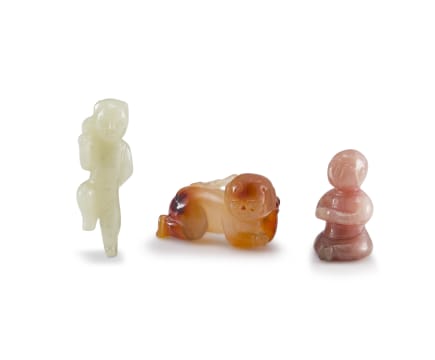 A Chinese carved agate figure of a small boy, early 20th century
