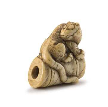 A Japanese ivory netsuke of a tiger, Meiji period, 1868-1912