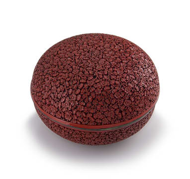 A Chinese carved cinnabar lacquer box and cover, Qing Dynasty, 18th/19th century