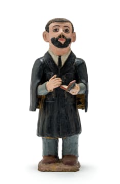 Noria Mabasa; Priest Dressed in Black