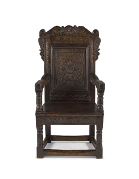 A carved oak Wainscot armchair, incorporating earlier elements, 18th/19th century
