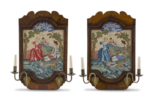 A pair of George II style walnut and embroidered sconces