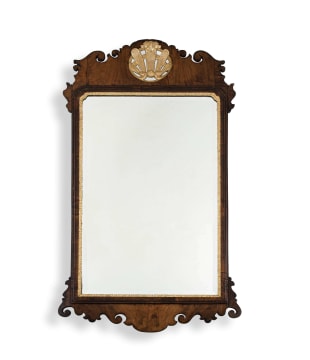 A George I walnut and parcel-gilt mirror, circa 1720