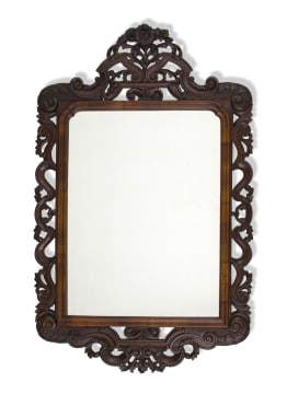 A carved walnut mirror, 19th century