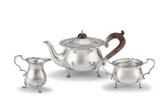 An Edwardian silver three-piece tea service, Mappin & Webb, Sheffield, 1904