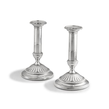 A pair of George III silver candlesticks, maker's marks worn, London, 1801