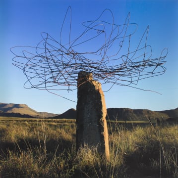 Strijdom van der Merwe; Clouds I: Collecting wire in the Sneeuberg Conservancy and placing it on top of a Rock