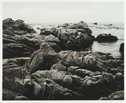 David Goldblatt; Memorial to a holiday maker, Bob O’Neill, who drowned here on 4 December 1990 after suffering a heart attack while fishing. The quotation from Psalm 23, He leadeth me beside the still waters, was painted by O’Neill’s son-in-law and has been renewed every year since by a local resident, John Burns. Pearly Beach, Western Cape. 25 January 2004