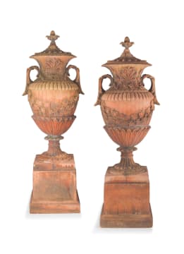 A pair of terracotta compostion two-handled garden urns-on-stands and covers, mid 20th century