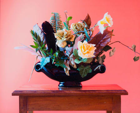 Sean Wilson; Foliage, Feathers, and Faux Flowers in Black Urn