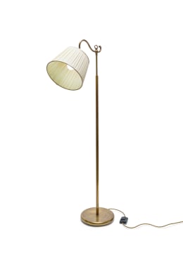 A brass adjustable standing lamp