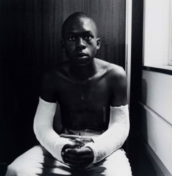 David Goldblatt; Fifteen-year-old Lawrence Matjee after his assault and detention by the Security Police, Khotso House, De Villiers Street