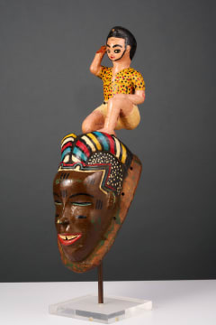 Guro mask with kneeling figure, Ivory Coast