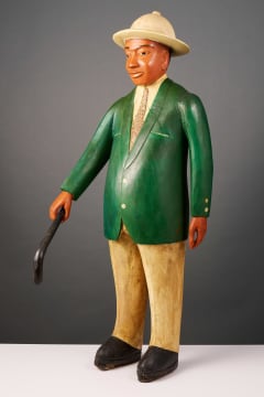 Colon standing figure in suit, West Africa