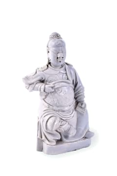 A Chinese Dehua figure of a Guandi, Qing dynasty, 17th or 18th century