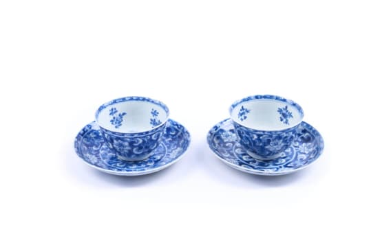 A pair of Chinese blue and white porcelain cups and saucers, Kangxi period, 1662-1722